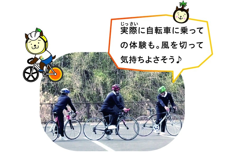 串間中学校の自転車講演会の写真３、実際に自転車に乗っての体験も。風を切って気持ちよさそう。